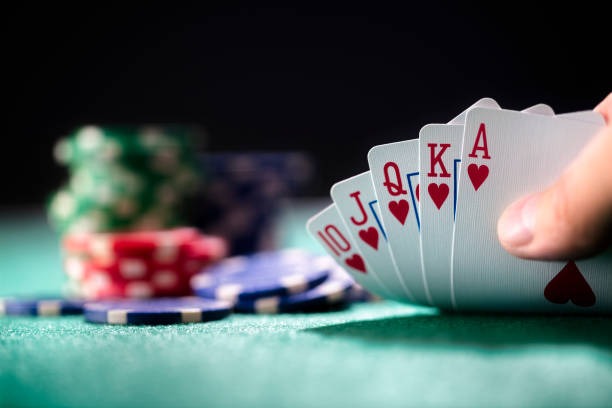 Live Baccarat dealer in broadcast studio with HD camera and card shoe
